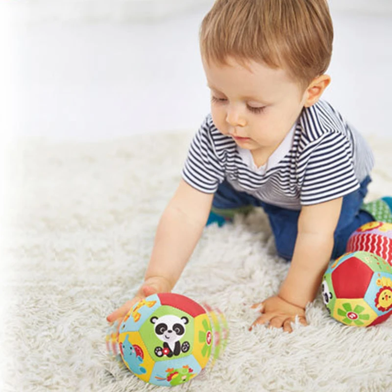 Kid playing with the Soothe Baby Balls Rattle